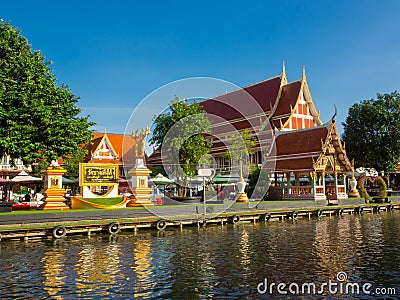 A beautiful golden roof Buddhist Temple near a canal. Editorial Stock Photo